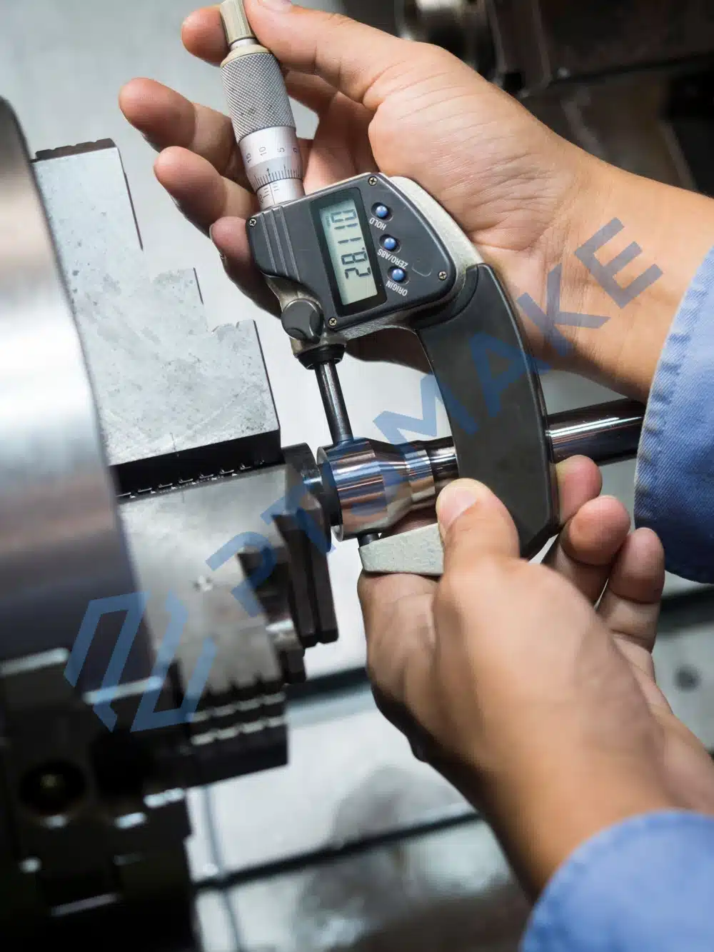Digital micrometer measuring the outside diameter of a turned metal component
