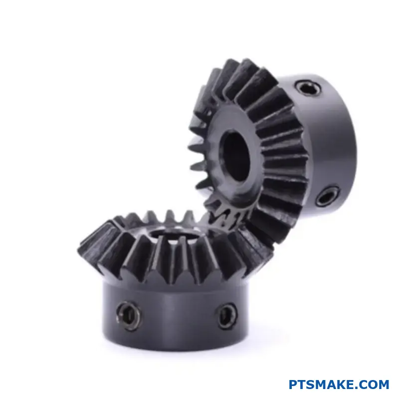 Two precision bevel gears with angled teeth engaged at ninety degree angle showing directional power transmission capability