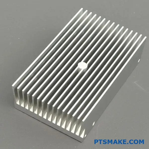 Close-up view of extruded aluminum heat sink showing parallel cooling fins and metallic finish