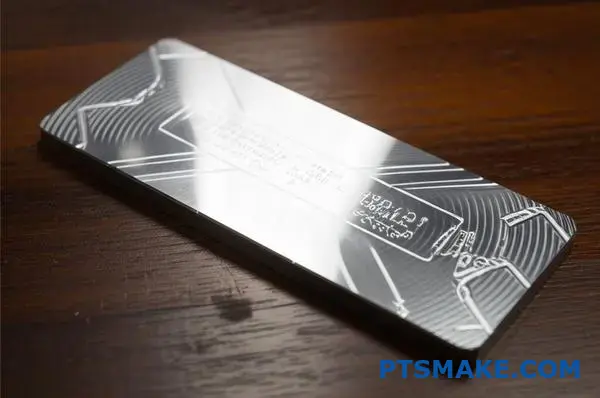 Clear anodized aluminum part showing precise laser engraved markings with excellent contrast on metallic surface