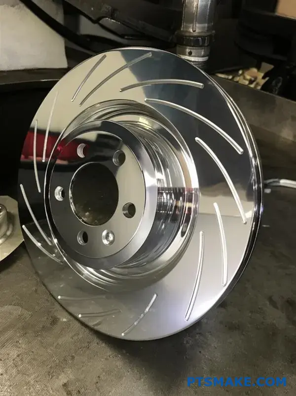 Precision machined brake rotor with high-quality chrome plating finish showcasing metallic surface treatment and professional manufacturing